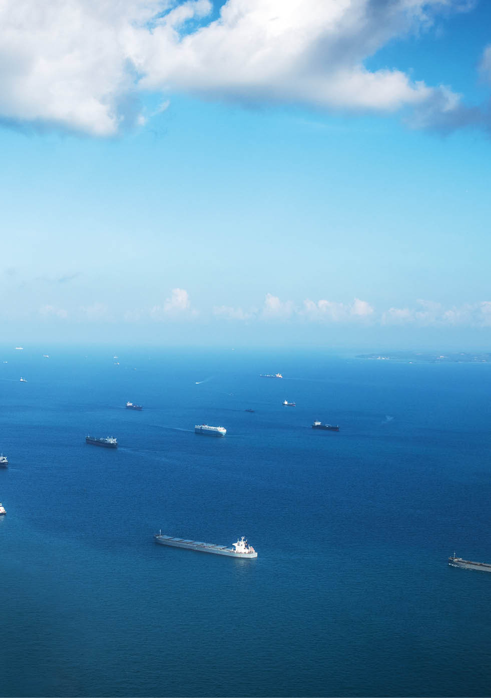 Singapore, Singapore: Transportation and Container ships wait on the ocean in front of the port of Singapore.